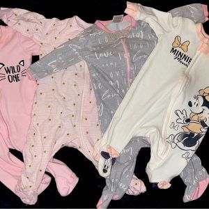 Four baby girl 0-3 sleeper pjamas each worn one time bundle